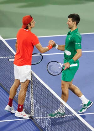 Lorenzo Musetti gratuliert dem Sieger Novak Djokovic (SRB) Tennis - Dubai Duty Free Tennis Championships - ATP, Tennis Herren - Dubai Duty Free Tennis Stadium - Dubai - - United Arab Emirates - 21 February 2022. Copyright: xJuergenxHasenkopfx