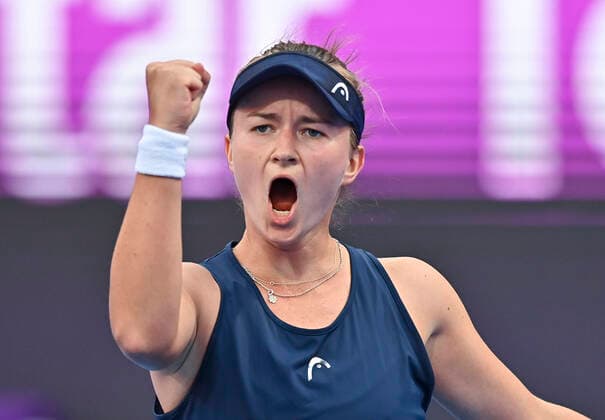 (220223) -- DOHA, Feb. 23, 2022 -- Barbora Krejcikova of Czech Republic serves during the second round of WTA, Tennis Damen Qatar Open tennis tournament match against Magda Linette of Poland at the Khalifa International Tennis Complex in Doha, capital of Qatar, on Feb. 22, 2022. (Photo by Nikku Xinhua) (SP)QATAR-DOHA-TENNIS-WTA QATAR OPEN-DAY 5 yangyuanyong 