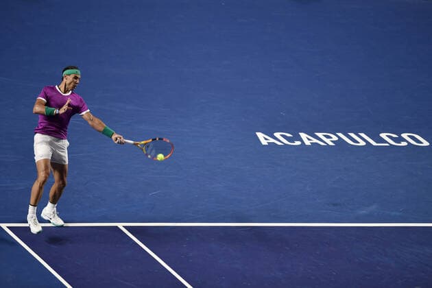 (220223) -- ACAPULCO, Feb. 23, 2022 -- Rafael Nadal of Spain hits a return during the men s singles first round match against Denis Kudla of the United States at the 2022 ATP, Tennis Herren Mexican Open tennis tournament in Acapulco, Mexico, Feb. 22, 2022. ) (SP)MEXICO-ACAPULCO-TENNIS-ATP-MEXICAN OPEN-FIRST ROUND XinxYuewei 