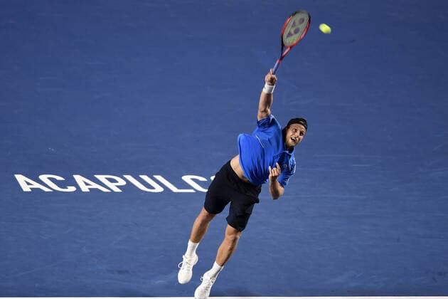 (220223) -- ACAPULCO, Feb. 23, 2022 -- Denis Kudla of the United States serves during the men s singles first round match against Rafael Nadal of Spain at the 2022 ATP, Tennis Herren Mexican Open tennis tournament in Acapulco, Mexico, Feb. 22, 2022. ) (SP)MEXICO-ACAPULCO-TENNIS-ATP-MEXICAN OPEN-FIRST ROUND XinxYuewei 