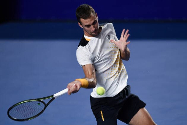 (220223) -- ACAPULCO, Feb. 23, 2022 -- Laslo Djere of Serbia hits a return during the men s singles first round match against Stefanos Tsitsipas of Greece at the 2022 ATP, Tennis Herren Mexican Open tennis tournament in Acapulco, Mexico, Feb. 22, 2022. ) (SP)MEXICO-ACAPULCO-TENNIS-ATP-MEXICAN OPEN-FIRST ROUND XinxYuewei 
