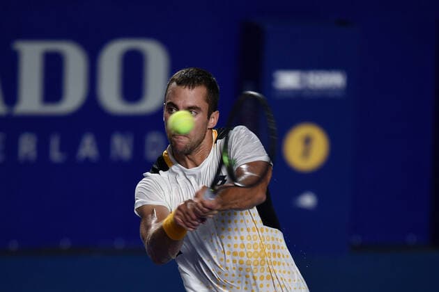 (220223) -- ACAPULCO, Feb. 23, 2022 -- Laslo Djere of Serbia hits a return during the men s singles first round match against Stefanos Tsitsipas of Greece at the 2022 ATP, Tennis Herren Mexican Open tennis tournament in Acapulco, Mexico, Feb. 22, 2022. ) (SP)MEXICO-ACAPULCO-TENNIS-ATP-MEXICAN OPEN-FIRST ROUND XinxYuewei 
