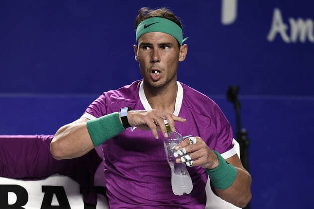 (220224) -- ACAPULCO, Feb. 24, 2022 -- Rafael Nadal of Spain reacts during a break time in the men s singles round of 16 match against Stefan Kozlov of the United States at the 2022 ATP, Tennis Herren Mexican Open tennis tournament in Acapulco, Mexico, Feb. 23, 2022. ) (SP)MEXICO-ACAPULCO-TENNIS-ATP-MEXICAN OPEN-ROUND OF 16 XinxYuewei 