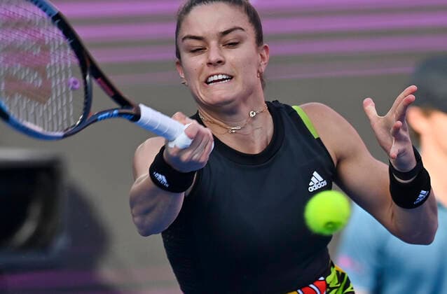 (220224) -- DOHA, Feb. 24, 2022 -- Maria Sakkari of Greece hits a return during the quarterfinal match of WTA, Tennis Damen Qatar Open tennis tournament between Maria Sakkari of Greece and Cori Gauff of the United States at the Khalifa International Tennis Complex in Doha, capital of Qatar, Feb. 24, 2022. (Photo by Nikku Xinhua) (SP)QATAR-DOHA-TENNIS-QATAR OPEN-QUARTERFINAL yangyuanyong 