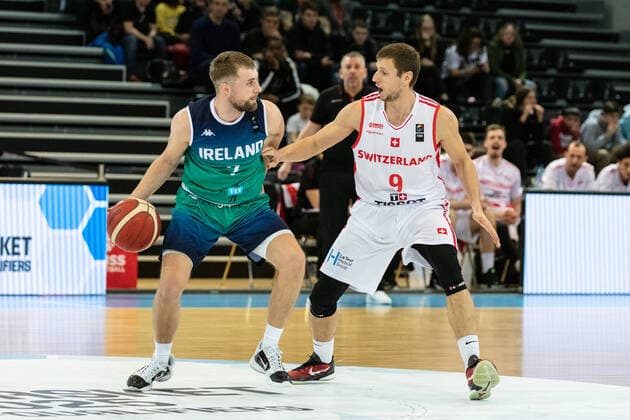 24.02.2022, Fribourg, Halle St. Leonard, FIBA Men& x92;s EuroBasket 2025 Pre-Qualification: Switzerland - Ireland, 7 Sean Flood (Ireland) face Ã 9 Roberto Kovac (Switzerland) Fribourg Halle St. Leonard Fribourg Switzerland Copyright: xJustPictures.ch SirianexDavetx