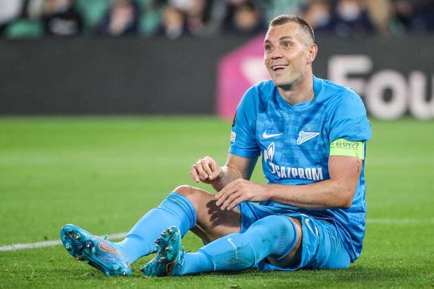SEVILLE, SPAIN â€“ FEBRUARY 24, 2022: Zenit St Petersburg s Artyom Dzyuba sits on the ground in the second leg of a UEFA Europa League playoff fooball match between Betis and Zenit St Petersburg at Benito Villamarin Stadium. Alexander Demianchuk TASS  TS1254DE