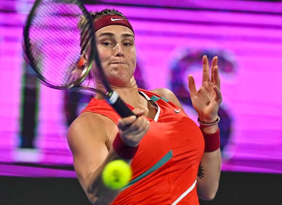 (220225) -- DOHA, Feb. 25, 2022 -- Aryna Sabalenka of Belarus hits a return during the quarterfinal match of WTA, Tennis Damen Qatar Open tennis tournament between Iga Swiatek of Poland and Aryna Sabalenka of Belarus at the Khalifa International Tennis Complex in Doha, capital of Qatar, Feb. 24, 2022. (Photo by Nikku Xinhua) (SP)QATAR-DOHA-TENNIS-QATAR OPEN-QUARTERFINAL yangyuanyong 
