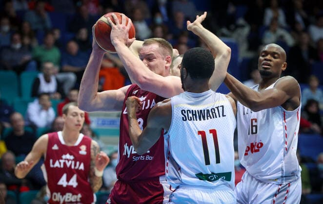 Latvian Klavs Cavars and Belgium s Loic Schwartz fight for the ball during a match between the Belgian national men team the Belgian Lions and Latvia, a qualifier match in Group A, ahead of the World Cup Basketball, Friday 25 February 2022, in Mons. VIRGINIExLEFOUR  x13778887x