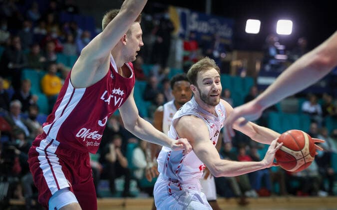 Belgium s Alexandre Libert fights for the ball during a match between the Belgian national men team the Belgian Lions and Latvia, a qualifier match in Group A, ahead of the World Cup Basketball, Friday 25 February 2022, in Mons. VIRGINIExLEFOUR  x13792546x
