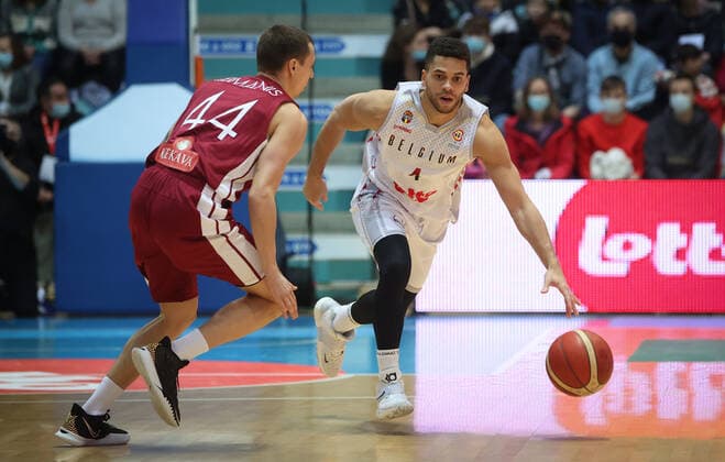 Latvian Toms Leimanis and Belgium s Emmanuel Lecomte fight for the ball during a match between the Belgian national men team the Belgian Lions and Latvia, a qualifier match in Group A, ahead of the World Cup Basketball, Friday 25 February 2022, in Mons. VIRGINIExLEFOUR  x13792888x