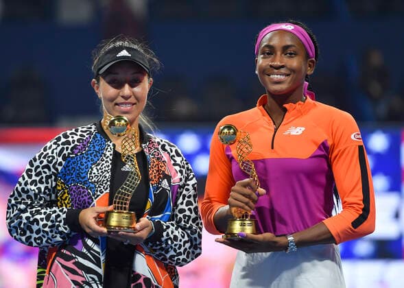 (220226) -- DOHA, Feb. 26, 2022 -- Cori Gauff (R) and Jessica Pegula of the United States pose with their trophies after the doubles final of the WTA, Tennis Damen Qatar Open tennis tournament against Veronica Kudermetova of Russia and Elise Mertens of Belgium in Doha, capital of Qatar, Feb. 25, 2022. (Photo by Xinhua) (SP)QATAR-DOHA-TENNIS-WTA QATAR OPEN-FINAL Nikku 