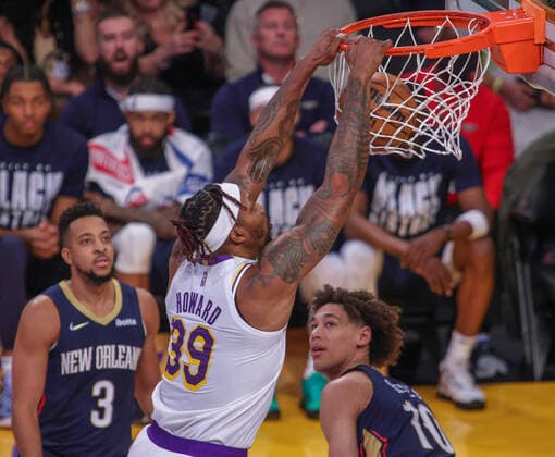 Dwight Howard 39 of the LA Lakers slams the ball as CJ McCollum 3 and Jaxson Hayes 10 observe, during an NBA, Basketball Herren, USA game between Los Angeles Lakers and New Orleans Pelicans, at Crypto.com Arena in Los Angeles, United States, 27 February 2022. Los Angeles Lakers vs New Orleans Pelicans !ACHTUNG: NUR REDAKTIONELLE NUTZUNG!  Copyright: xPHILLIPxKIMx AME9174 20220228-8f2d8b2743e404ec01a03aaf4ae8fc81bcba3461