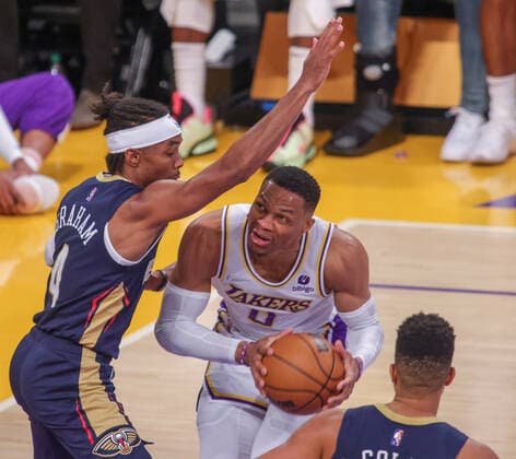 Russell Westbrook 0 of the LA Lakers is guarded by Devonte Graham 4 of the New Orleans Pelicans, during an NBA, Basketball Herren, USA game between Los Angeles Lakers and New Orleans Pelicans, at Crypto.com Arena in Los Angeles, United States, 27 February 2022. Los Angeles Lakers vs New Orleans Pelicans !ACHTUNG: NUR REDAKTIONELLE NUTZUNG!  Copyright: xPHILLIPxKIMx AME9212 20220228-f7ed4b9d2fff46b3893d27e4678269a14d3b20bb