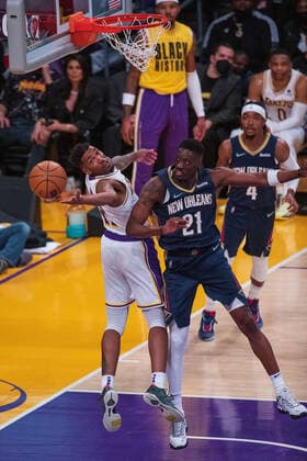 February 27, 2022, Los Angeles, California, USA: Malik Monk 11 of the Los Angeles Lakers loses the ball due to a block from Tony Snell 21 of the New Orleans Pelicans during their NBA, Basketball Herren, USA game on Sunday February 27, 2022 at the Crypto.com Arena in Los Angeles, California. Lakers lose to Pelicans, 95-123. ARIANA RUIZ PI Los Angeles USA - ZUMAp124 20220227_zaa_p124_152 Copyright: xArianaxRuizx