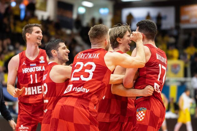 220228 Players of Croatia celebrate after the FIBA World Cup Qualifier game between Sweden and Croatia on February 28, 2022 in Norrköping. Copyright: PETERxHOLGERSSON BB220228PH056