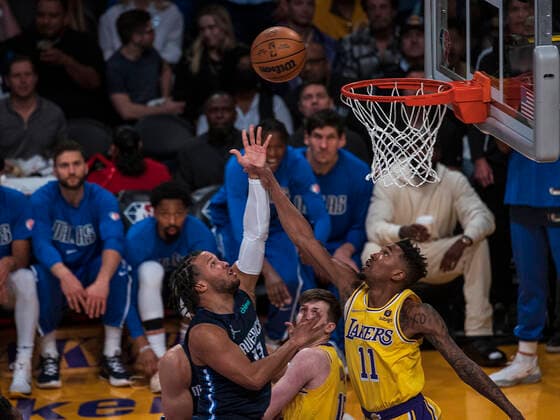 March 1, 2022, Los Angeles, California, USA: Jalen Brunson 13 of the Dallas Mavericks puts a shot over Malik Monk 11 of the Los Angeles Lakers during their NBA, Basketball Herren, USA game on Tuesday March 1, 2022 at Crypto.com Arena in Los Angeles, California. Lakers lose to Mavericks, 104-109. PI Los Angeles USA - ZUMAp124 20220301_zaa_p124_015 Copyright: xJAVIERxROJASx