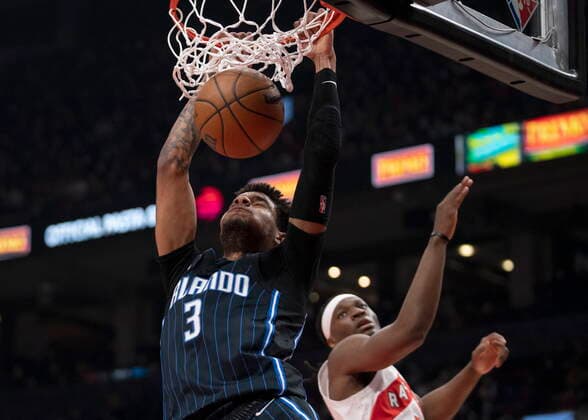 March 4, 2022, Toronto, on, Canada: Orlando Magic forward Chuma Okeke (3) slams home a dunk past Toronto Raptors forward Precious Achiuwa (5) during first half NBA, Basketball Herren, USA action in Toronto on Friday March 4, 2022. Canada News - March 4, 2022  - ZUMAc35_ 20220304_zaf_c35_042 Copyright: xFrankxGunnx
