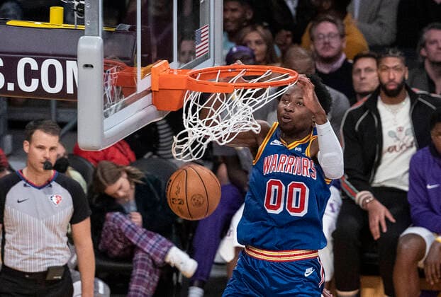 March 5, 2022, Los Angeles, California, USA: Jonathan Kuminga 00 of the Golden State Warriors dunks the ball during their NBA, Basketball Herren, USA game against the Los Angeles Lakers on Saturday March 5, 2022 at Crypto.com Arena in Los Angeles, California. Lakers defeat Warriors, 124-116. PI Los Angeles USA - ZUMAp124 20220305_zaa_p124_029 Copyright: xJAVIERxROJASx