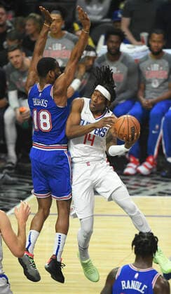 LOS ANGELES, CA - MARCH 06: LA Clippers guard Terance Mann (14) goes up against New York Knicks guard Alec Burks (18) during the first half in a NBA, Basketball Herren, USA basketball game played at on March 6, 2022 at Crypto.com arena in Los Angeles, CA. (Photo by John McCoy Icon Sportswire) NBA: MAR 06 Knicks at Clippers Icon2203060435