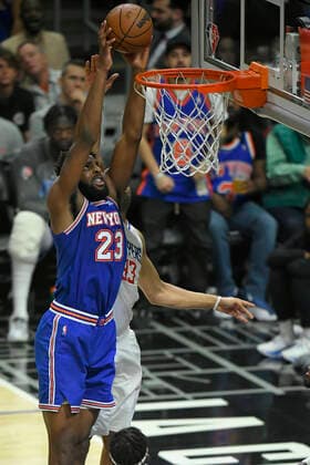 LOS ANGELES, CA - MARCH 06: New York Knicks center Mitchell Robinson (23) gets past LA Clippers forward Nicolas Batum (33) for a dunk during the first half in a NBA, Basketball Herren, USA basketball game played at on March 6, 2022 at Crypto.com arena in Los Angeles, CA. (Photo by John McCoy Icon Sportswire) NBA: MAR 06 Knicks at Clippers Icon2203060986