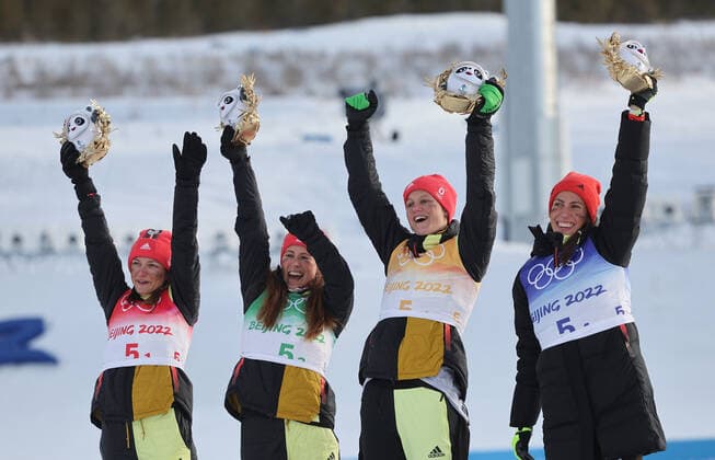 Silver medallists Katherine Sauerbrey, Katharina Hennig, Victoria Carl and Sofie Krehl of Team Germany celebrate during the Women s Cross-Country 4x5km Relay flower ceremony on Day 8 of the Beijing 2022 Winter Olympics at The National Cross-Country Skiing Centre on February 12, 2022 in Zhangjiakou, China. 