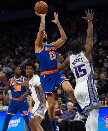 March 7, 2022, Sacramento, CA, USA: New York Knicks guard Evan Fournier (13) drives over Sacramento Kings guard Davion Mitchell (15) fro a basket during a game at Golden 1 Center in Sacramento, Monday, March 7, 2022. Sacramento USA - ZUMAj89_ 0152635956st Copyright: xPaulxKitagakixJr.x