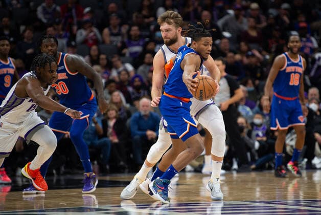 March 7, 2022, Sacramento, CA, USA: New York Knicks guard Miles McBride (2) grabs rebound from Sacramento Kings forward Domantas Sabonis (10) during a game at Golden 1 Center in Sacramento, Monday, March 7, 2022. Sacramento USA - ZUMAj89_ 0152635986st Copyright: xPaulxKitagakixJr.x