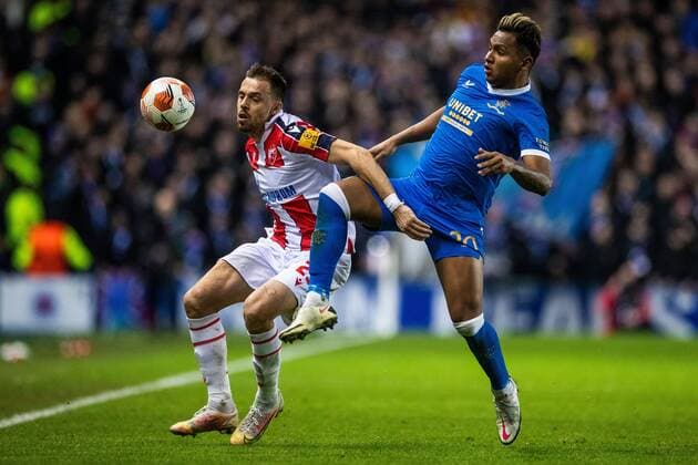 Mandatory Credit: Photo by Kirk O Rourke Rangers FC Shutterstock (12843268cd) Milan Rodic of Red Star Belgrade battles with Alfredo Morelos of Rangers during the Europa League match at Ibrox Stadium, Glasgow. Rangers v Red Star Belgrade, Europa League, Round of 16, First Leg, Football, Ibrox Stadium, Glasgow, UK - 10 Mar 2022 EDITORIAL USE ONLY No use with unauthorised audio, video, data, fixture lists, club league logos or live services. Online in-match use limited to 120 images, no video emulation. No use in betting, games or single club league player publications. Rangers v Red Star Belgrade, Europa League, Round of 16, First Leg, Football, Ibrox Stadium, Glasgow, UK - 10 Mar 2022 EDITORIAL USE ONLY No use with unauthorised audio, video, data, fixture lists, club league logos or live services. Online in-match use limited to 120 images, no video emulation. No use in betting, games or single club league player publications. Copyright: xKirkxO Rourke RangersxFC Shutterstockx 12843268cd