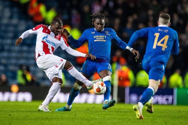 Mandatory Credit: Photo by Kirk O Rourke Rangers FC Shutterstock (12843268cq) Calvin Bassey of Rangers battles for the ball during the Europa League match at Ibrox Stadium, Glasgow. Rangers v Red Star Belgrade, Europa League, Round of 16, First Leg, Football, Ibrox Stadium, Glasgow, UK - 10 Mar 2022 EDITORIAL USE ONLY No use with unauthorised audio, video, data, fixture lists, club league logos or live services. Online in-match use limited to 120 images, no video emulation. No use in betting, games or single club league player publications. Rangers v Red Star Belgrade, Europa League, Round of 16, First Leg, Football, Ibrox Stadium, Glasgow, UK - 10 Mar 2022 EDITORIAL USE ONLY No use with unauthorised audio, video, data, fixture lists, club league logos or live services. Online in-match use limited to 120 images, no video emulation. No use in betting, games or single club league player publications. Copyright: xKirkxO Rourke RangersxFC Shutterstockx 12843268cq