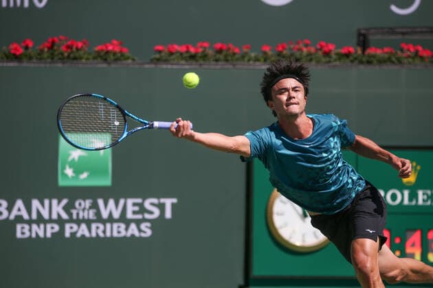 INDIAN WELLS, CA - MARCH 11: Taro Daniel (JPN) stretches for a forehand during the BNP Paribas Open on March 11, 2022 at Indian Wells Tennis Garden in Indian Wells, CA. (Photo by George Walker Icon Sportswire) TENNIS: MAR 11 BNP Paribas Open Icon220311015