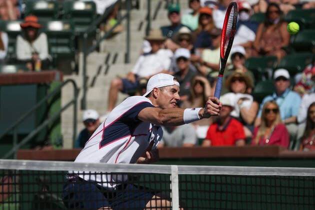 INDIAN WELLS, CA - MARCH 11: John Isner (USA) hits a volley during the BNP Paribas Open on March 11, 2022 at Indian Wells Tennis Garden in Indian Wells, CA. (Photo by George Walker Icon Sportswire) TENNIS: MAR 11 BNP Paribas Open Icon220311034