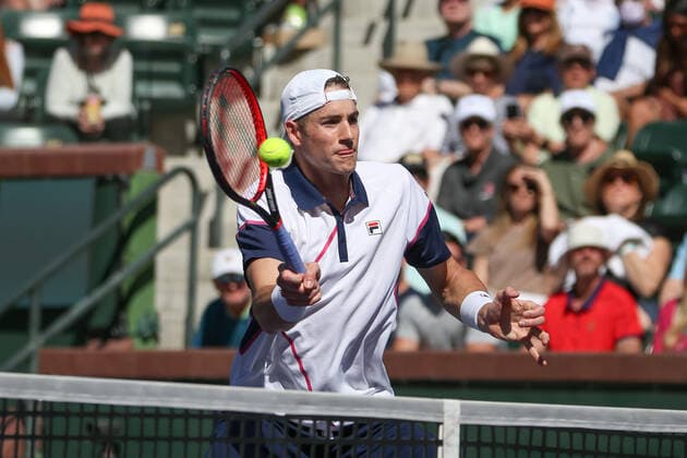 INDIAN WELLS, CA - MARCH 11: John Isner (USA) hits a volley during the BNP Paribas Open on March 11, 2022 at Indian Wells Tennis Garden in Indian Wells, CA. (Photo by George Walker Icon Sportswire) TENNIS: MAR 11 BNP Paribas Open Icon220311035