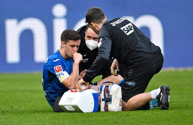 Christoph Baumgartner TSG 1899 Hoffenheim (14) Verletzung verletzt am Boden Betreuer TSG 1899 Hoffenheim vs FC Bayern Muenchen FCB 12.03.2022 DFL REGULATIONS PROHIBIT ANY USE OF PHOTOGRAPHS AS IMAGE SEQUENCES AND OR QUASI-VIDEO TSG 1899 Hoffenheim vs FC Bayern Muenchen FCB
