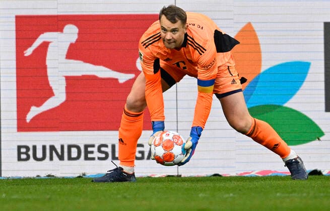 Torwart Manuel Neuer FC Bayern Muenchen FCB (01) faengt Ball Aktion vor Logo Bundesliga TSG 1899 Hoffenheim vs FC Bayern Muenchen FCB 12.03.2022 DFL REGULATIONS PROHIBIT ANY USE OF PHOTOGRAPHS AS IMAGE SEQUENCES AND OR QUASI-VIDEO TSG 1899 Hoffenheim vs FC Bayern Muenchen FCB