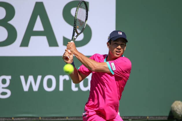 INDIAN WELLS, CA - MARCH 12: Mackenzie McDonald (USA) hits a backhand during the BNP Paribas Open on March 12, 2022 at Indian Wells Tennis Garden in Indian Wells, CA. (Photo by George Walker Icon Sportswire) TENNIS: MAR 12 BNP Paribas Open Icon220312001