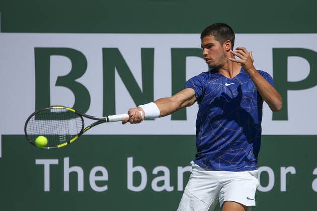 INDIAN WELLS, CA - MARCH 12: Carlos Alvaraz (ESP) hits a forehand during the BNP Paribas Open on March 12, 2022 at Indian Wells Tennis Garden in Indian Wells, CA. (Photo by George Walker Icon Sportswire) TENNIS: MAR 12 BNP Paribas Open Icon220312002