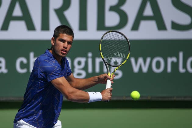 INDIAN WELLS, CA - MARCH 12: Carlos Alvaraz (ESP) hits a backhand during the BNP Paribas Open on March 12, 2022 at Indian Wells Tennis Garden in Indian Wells, CA. (Photo by George Walker Icon Sportswire) TENNIS: MAR 12 BNP Paribas Open Icon220312003