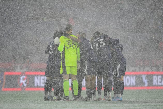 March 12, 2022: New England Revolution huddle in near whiteout conditions before the start of the MLS, Fussball Herren, USA match between Real Salt Lake and the New England Revolution held at Gillette Stadium in Foxborough Massachusetts. CSM Foxborough USA - ZUMAc04_ 20220312_zaf_c04_170 Copyright: xEricxCanhax