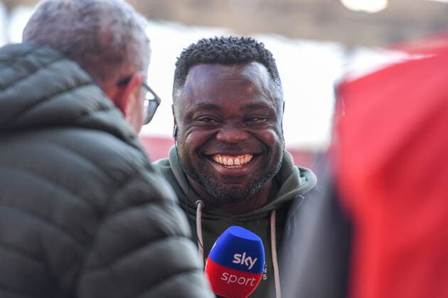 Gerald Asamoah (Leiter Lizenz, Schalke) lachend beim Interview, TV, Fernsehen, Mikrofon, 13.03.2022, Ingolstadt (Deutschland), Fussball, 2. Bundesliga, FC Ingolstadt 04 - FC Schalke 04, DFB DFL REGULATIONS PROHIBIT ANY USE OF PHOTOGRAPHS AS IMAGE SEQUENCES AND OR QUASI-VIDEO.