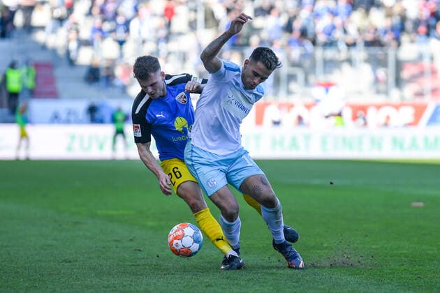 v.li.: Florian Pick (FC Ingolstadt, 26) Rodrigo Zalazar (Schalke, 10) im Zweikampf, Duell, duel, tackle, Dynamik, Action, Aktion, 13.03.2022, Ingolstadt (Deutschland), Fussball, 2. Bundesliga, FC Ingolstadt 04 - FC Schalke 04, DFB DFL REGULATIONS PROHIBIT ANY USE OF PHOTOGRAPHS AS IMAGE SEQUENCES AND OR QUASI-VIDEO.