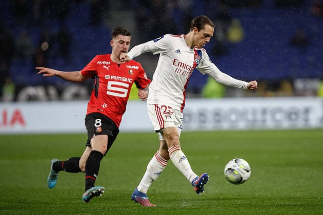 Maxence Caqueret (Olympique Lyonnais) vs Baptiste Santamaria (Rennes) FOOTBALL : Olympique Lyonnais vs Stade Rennais - Ligue 1 Uberteat - 13 03 2022 AurelienMorissard Panoramic 