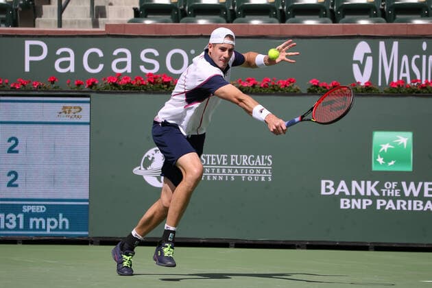 INDIAN WELLS, CA - MARCH 13: John Isner (USA) hits a backhand during the BNP Paribas Open on March 12, 2022 at Indian Wells Tennis Garden in Indian Wells, CA. (Photo by George Walker Icon Sportswire) TENNIS: MAR 13 BNP Paribas Open Icon220313010