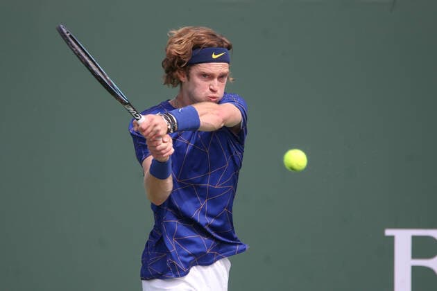 INDIAN WELLS, CA - MARCH 13: Andrey Rublev hits a backhand during the BNP Paribas Open on March 12, 2022 at Indian Wells Tennis Garden in Indian Wells, CA. (Photo by George Walker Icon Sportswire) TENNIS: MAR 13 BNP Paribas Open Icon220313018