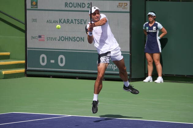 INDIAN WELLS, CA - MARCH 13: Aslan Karatsev hits a backhand during the BNP Paribas Open on March 12, 2022 at Indian Wells Tennis Garden in Indian Wells, CA. (Photo by George Walker Icon Sportswire) TENNIS: MAR 13 BNP Paribas Open Icon220313021
