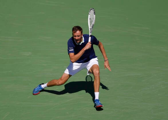 March 14, 2022 Daniil Medvedev of Russia returns a shot against Gael Monfils of France during the 2022 BNP Paribas Open at Indian Wells Tennis Garden in Indian Wells, California. Mandatory Photo Credit: CSM. Indian Wells United States of America - ZUMAc04_ 20220314_zaf_c04_031 Copyright: xCharlesxBausx