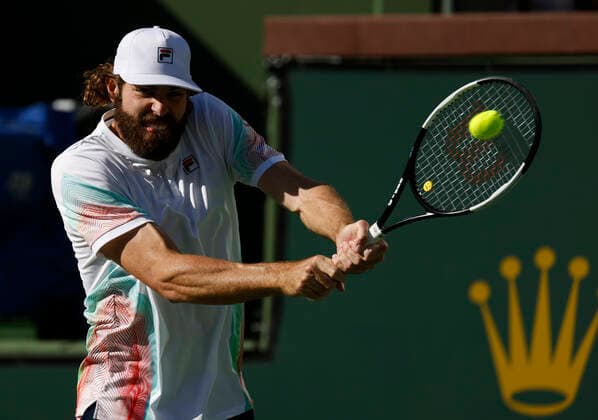March 14, 2022 Reilly Opelka returns a shot against Denis Shapovalov of Canada during the 2022 BNP Paribas Open at Indian Wells Tennis Garden in Indian Wells, California. Mandatory Photo Credit: CSM. Indian Wells United States of America - ZUMAc04_ 20220314_zaf_c04_100 Copyright: xCharlesxBausx
