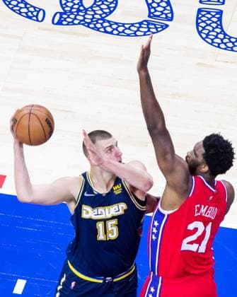 Philadelphia, Pennsylvania, United States of America, March 14th 2022: Nikola Jokic (Nuggets 15) going against Joel Embiid (76ers 21) during the National Basketball Association game between the Philadelphia 76ers and Denver Nuggets at Wells Fargo Center in Philadelphia, PA (NO COMMERCIAL USAGE) Georgia Soares SPP Philadelphia 76ers v Denver Nuggets 