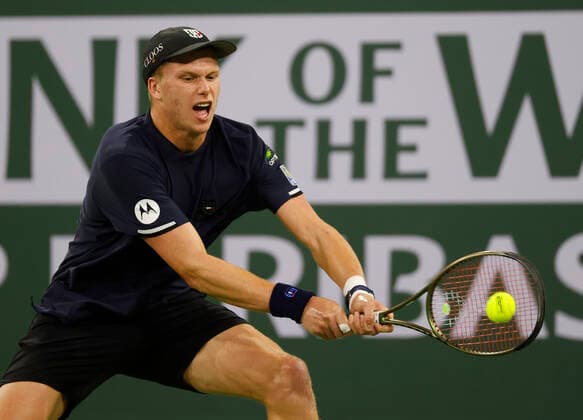 March 14, 2022 Jenson Brooksby returns a shot against Stefanos Tsitsipas of Greece during the 2022 BNP Paribas Open at Indian Wells Tennis Garden in Indian Wells, California. Mandatory Photo Credit: CSM. Indian Wells United States of America - ZUMAc04_ 20220314_zaf_c04_143 Copyright: xCharlesxBausx