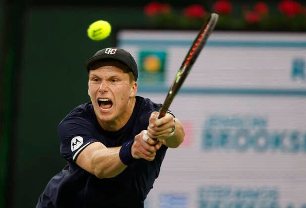 March 14, 2022 Jenson Brooksby returns a shot against Stefanos Tsitsipas of Greece during the 2022 BNP Paribas Open at Indian Wells Tennis Garden in Indian Wells, California. Mandatory Photo Credit: CSM. Indian Wells United States of America - ZUMAc04_ 20220314_zaf_c04_146 Copyright: xCharlesxBausx