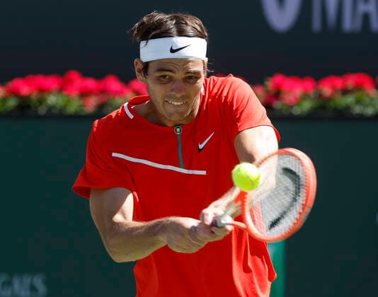 March 16, 2022 Taylor Fritz returns a shot against Alex De Minaur of Australia during the 2022 BNP Paribas Open at Indian Wells Tennis Garden in Indian Wells, California. Mandatory Photo Credit: CSM. Indian Wells United States of America - ZUMAc04_ 20220316_zaf_c04_110 Copyright: xCharlesxBausx